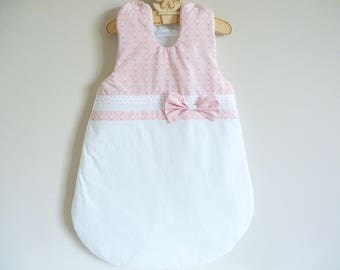 Sleeping bag was pink, white, 0/6 months