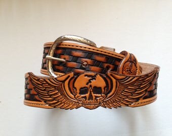Belt leather tooled with skull in cutting carved