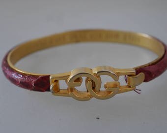 Gucci bracelet with logo and snakeskin 70s gold plated