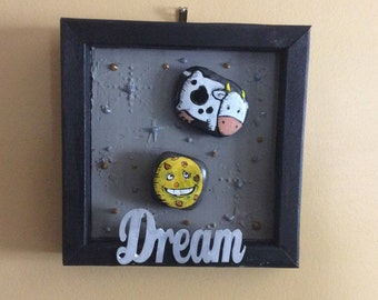 Stone art cow jumped over the moon