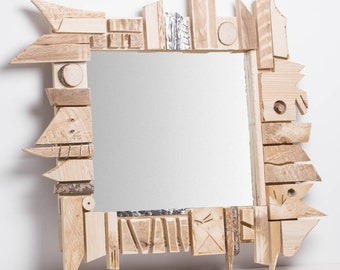 Ongle. Abstract mirror, wood and aluminum frame, cuts polygonal of antique furniture.