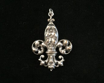antique french fleur de lis amulet