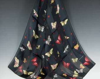 Black magic ECHO foulard scarf in sheer and satiny black stripes with moth and butterfly motif in colors.