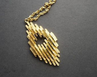1970s modernist abstract gold tone metal textured pendant on chain