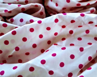 Silk pink and white polka dot fabric