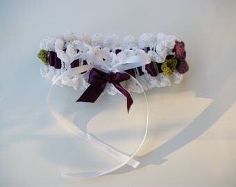 Purple and white garter made with crochet