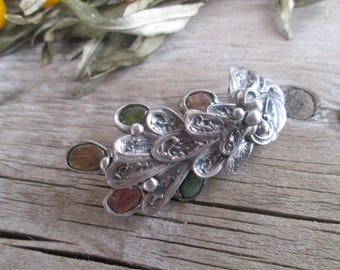metal brooch with Natural tourmalines.