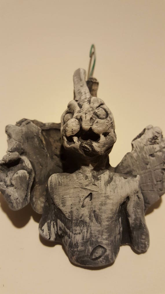 blue exorcist statue