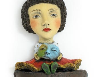 Title: "Choosing My Disguise" Wall mount ceramic sculpture, 19" x 6" x 3"
