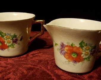 REDUCED! Porcelain cream and sugar set with a poppy floral decal on the side, Kleine Co. porcelain cream and sugar set, serving set, gold