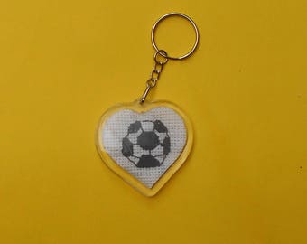 Heart shaped key chain with a football