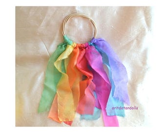 Silkplay strips on a scion circle with jingle bells eco colors for children dance and play