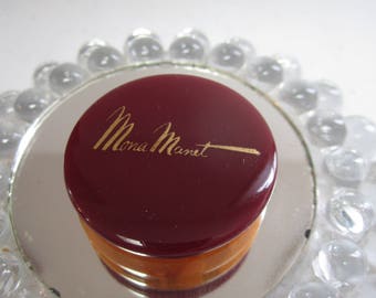 Vintage unused NOS art deco 1940's maroon and swirled butterscotch Bakelite Mona Manet Rouge container paper label and price black americana