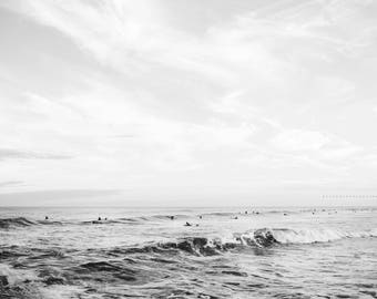 surfers at dusk