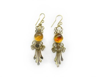 amber earrings / medium light yellow stone with golden brown texture / round shaped / wrapping wire / mexican amber