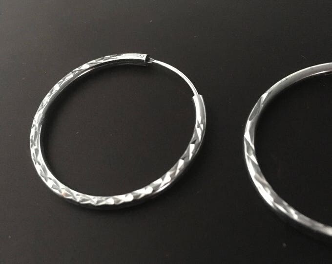 Elegant Silver Hoop Earrings with Patterned Surface