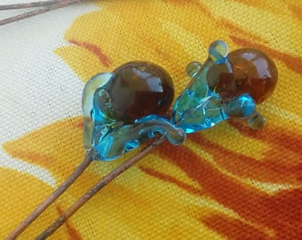 Duets with flowers in Blue Lagoon and amber heart - Lampwork Glass
