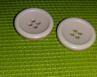 set of 2 buttons pink × × ×.