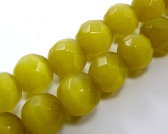 Set of 4 10 mm yellow faceted cat's eye glass beads