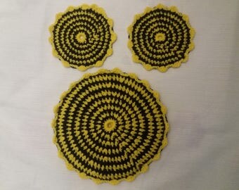 Trivet set and two pot holders yellow black