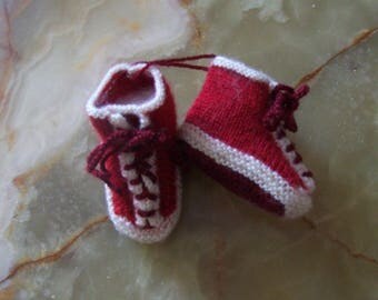 shape red sneakers with laces crocheted baby booties