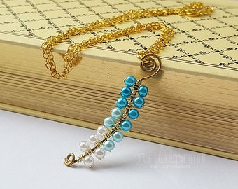 zelda twilight princess vessel of light necklace, the legend of zelda necklace, vessel of light, beaded spiral necklace, nintendo jewellery