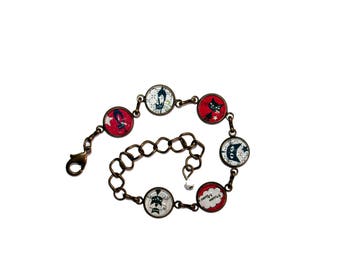Bracelet bronze "Black cats" on red with white polka dots and black cats on checked background