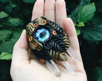 CLAY PENDANT - with glass eye & clear quartz points.