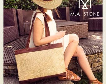 Large tote bag in camel leather and straw.