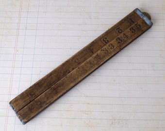Vintage wooden folding ruler or measuring stick