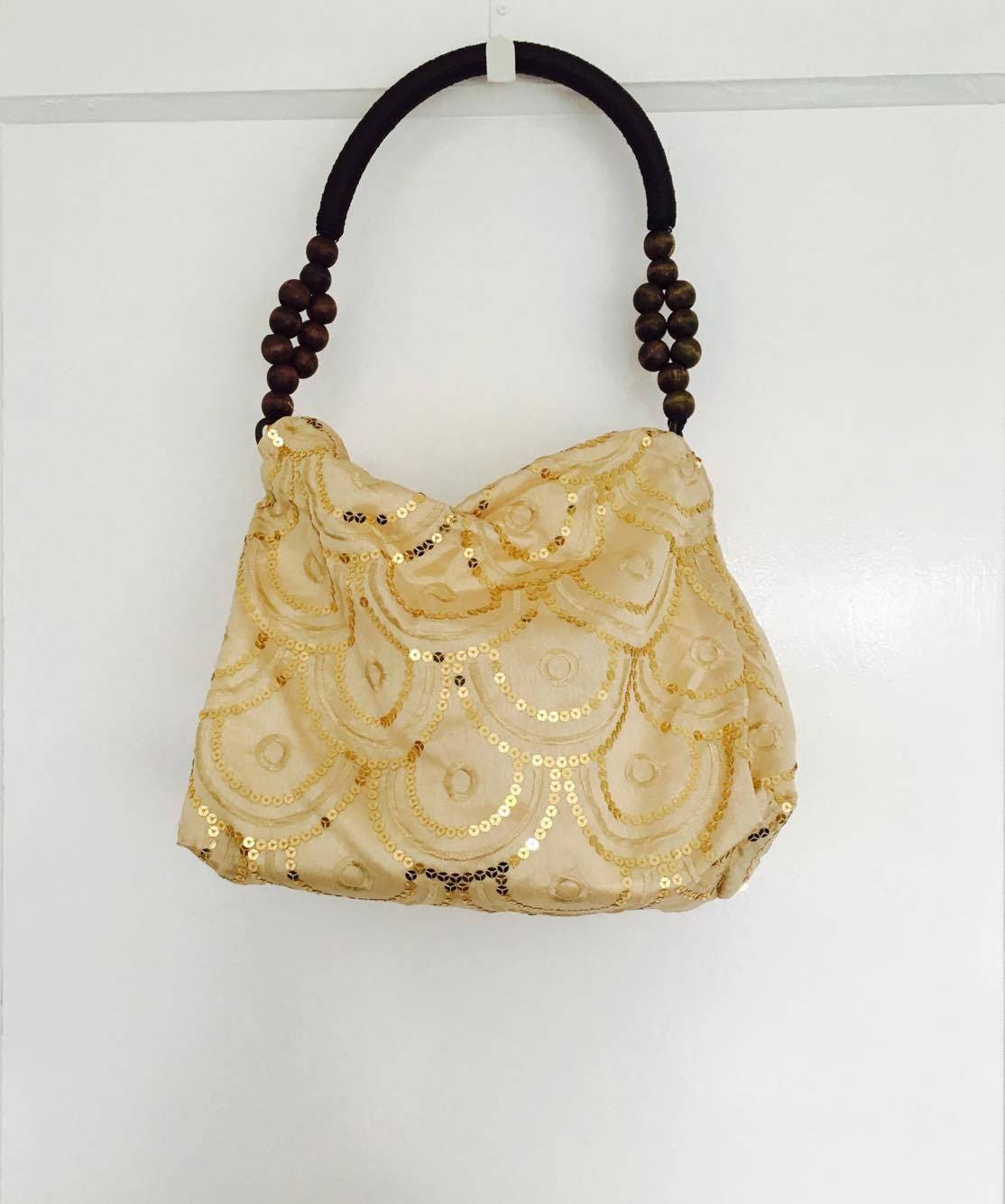 gold sequin handbag