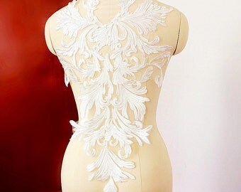 White wedding dress with red tribal design panels. White wedding dress with red tribal design panels.
