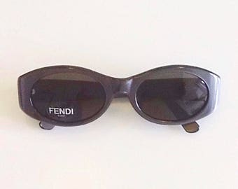 Vintage designer sunglasses by Fendi, pearl grey colour, elegant retro-style shape