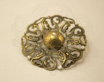 Bronze colored filigree vintage brooch.
