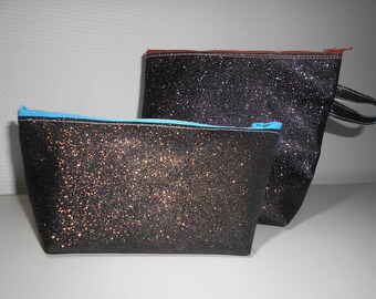 The two sequined black makeup kits