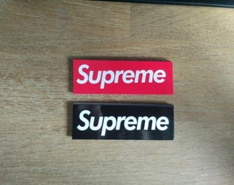 12 small Supreme stickers red/black/mixed