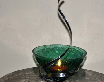 candle holder wrought iron and a candle or tapered green bubble glass vase