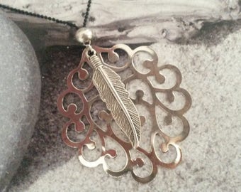 Silver charm necklace and its silver feather