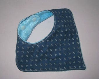 Blue bandana bib printed with anchors, nautical birthday gift
