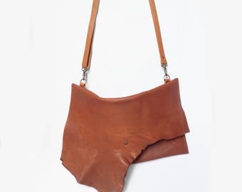 Cognac leather clutch with irregular flap