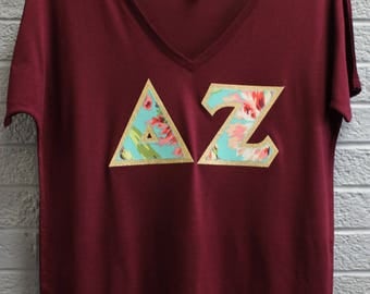 Delta Zeta Maroon Bella Flowy V-Neck With Amy Butler Bliss Bouquet on Gold Metallic (254C)
