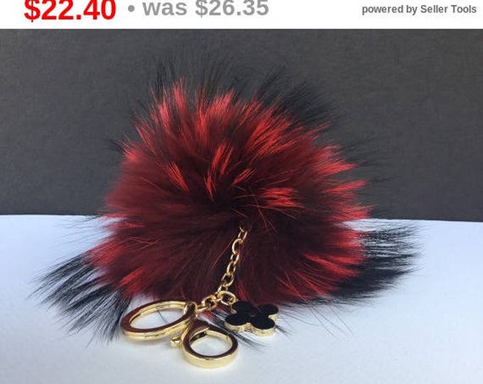 Deep red with natural markings Raccoon Fur Pom Pom luxury bag pendant + black flower clover charm keychain