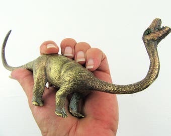 brass dinosaur figurine