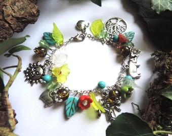 "Country walk" Bracelet: Sun, scarecrow, pig, RAM, Apple, tree of life, lucites green and red flowers, pearls