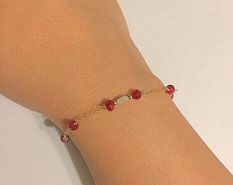 Faceted rubies and rough white diamond bracelet