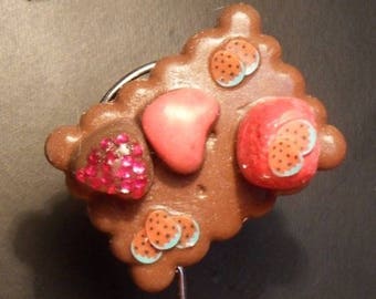 Embellished with her pink hearts in polymer clay magnet