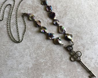 Irridesent purple key charm necklace // skeleton key necklace // unique lariat necklace