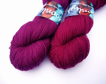 Yarn sock weight Hand dyed 100% Superwash Merino- purpleish plum (left)