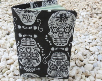 A passport sleeve with a skullsdesign. Passport cover.