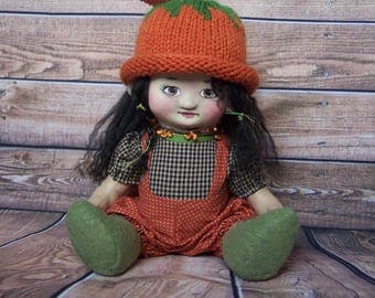 Punkin', a cloth and clay Autumn, Fall, or Halloween pumpkin art doll by Jan Conwell